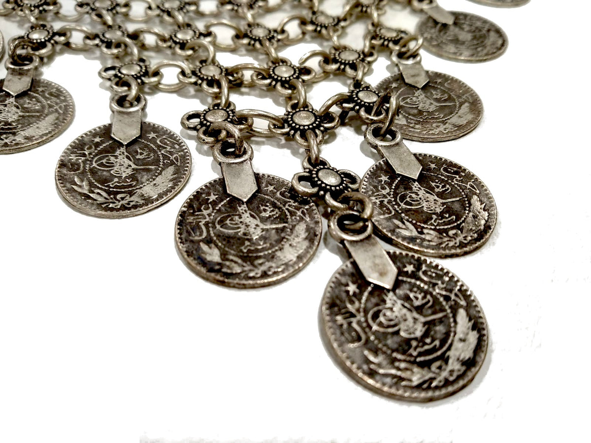 Collana a maglia in Zama con pendenti moneta