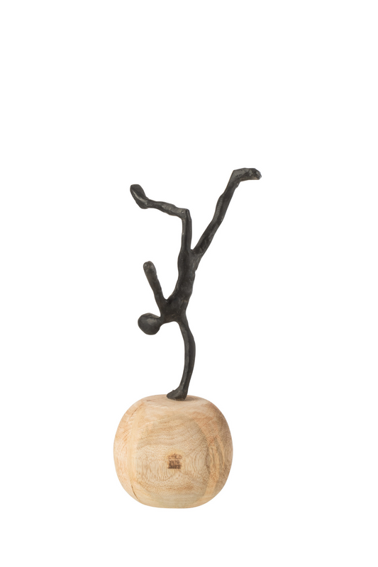 Scultura in legno di mango e alluminio nero "Equilibrista su una mano"