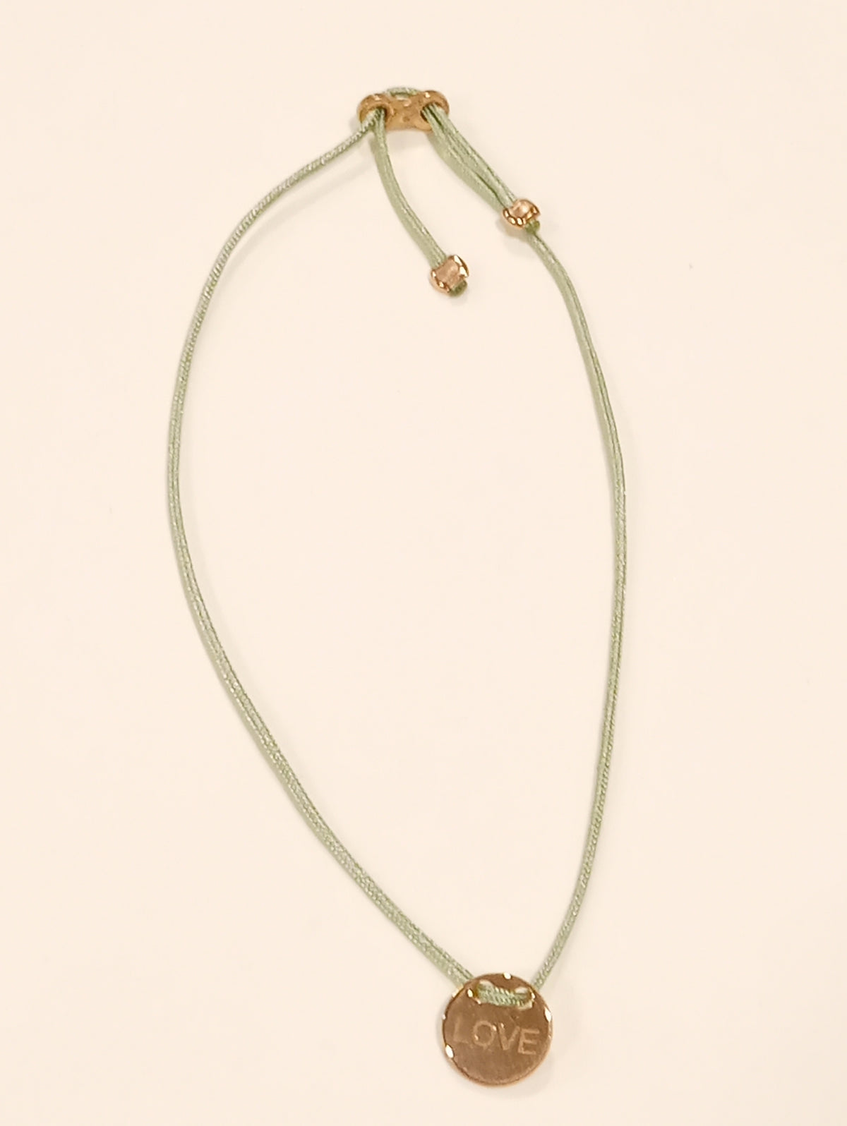 Bracciale in argento placcato dorato love con laccio verde