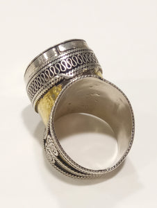 Anello in argento bicolore con punzonature e elementi in ottone