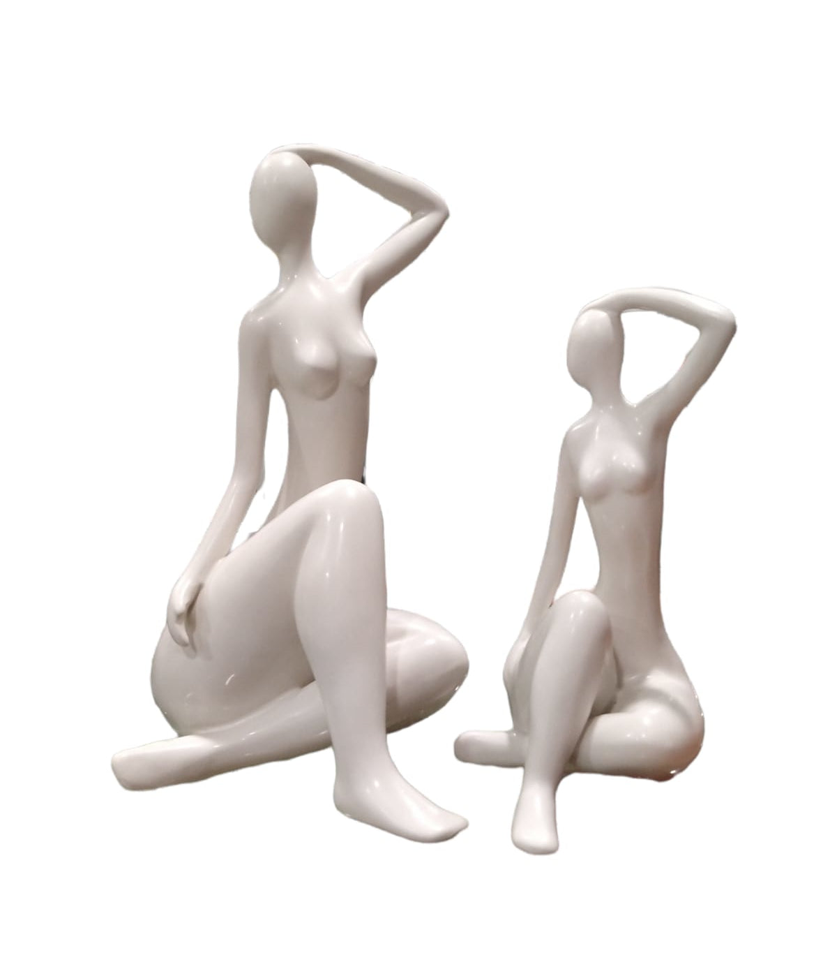 Scultura in ceramica smaltata bianca  "Figura seduta"